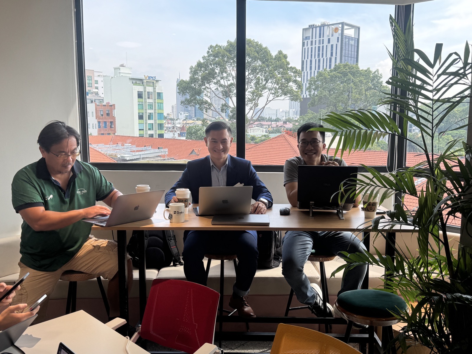The Edge8 team with the Saigon skyline